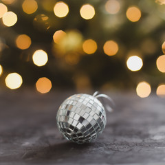 Fototapeta na wymiar Beautiful christmas silver ball on dark black background. Copy Space. trendy holiday concept. Christmas Decoration. 