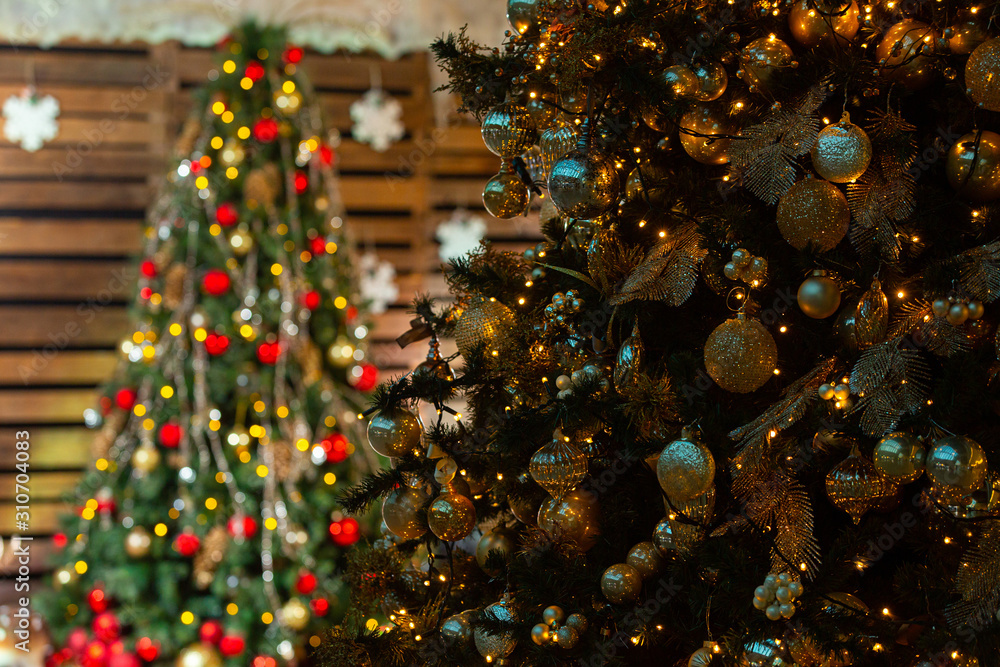 Wall mural red and gold christmas ball on christmas tree with light bulb on wooden wall background