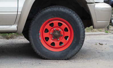 Fototapeta na wymiar Closeup photo of red car wheel