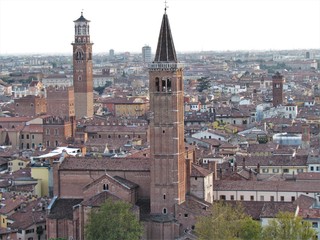 Obraz premium View of Verona Streets and Architecture. The Beautiful city of Romeo and Julietta shows its beauty full of details and history. Towers (Torre di Lamberti), Bridges (Ponte di Castelvecchio).