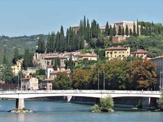 View of Verona Streets and Architecture. The Beautiful city of Romeo and Julietta shows its beauty full of details and history. Towers (Torre di Lamberti), Bridges (Ponte di Castelvecchio).
