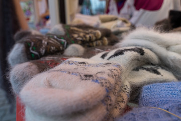 knitted woolen socks are for sale at the Christmas market in Moscow