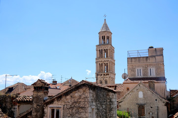 Fototapeta na wymiar Old stone buildings and landmark Saint Domnoius bell tower in central Split, Croatia.