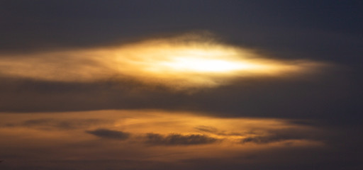 Strange sunrise with cloud opening like an eye