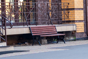 lonely bench. A vacant riverside bench on a sunny evening