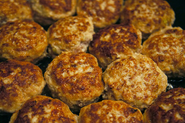 Fried meat cutlets rissole meatballs of minced pork in a pan.