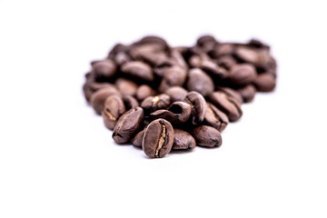 Close up of coffee beans on a white background