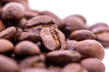 Close up of coffee beans on a white background