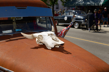 Rusted Ford Mercury M-1 truck with steer skull on hood at Coldwater steampunk festival