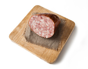Meat cutting on a board, lard on white background. Top view