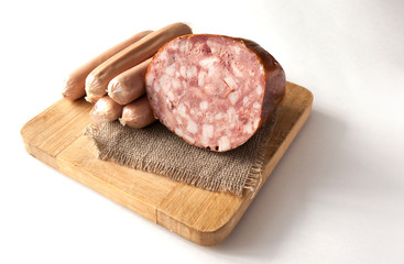 Meat cutting on a board, lard on white background. Top view
