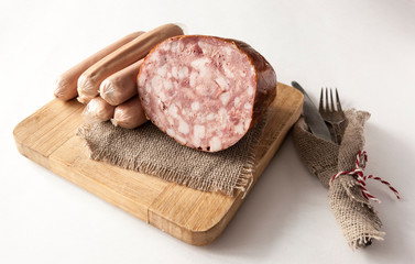 Meat cutting on a board, lard on white background. Top view