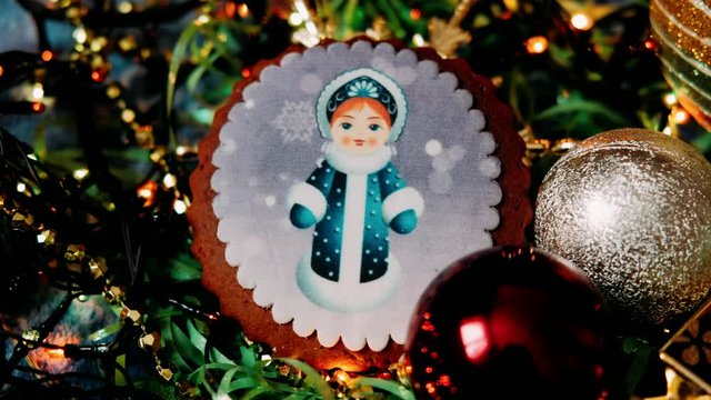Round cookies with the image of a snow maiden in a blue outfit.