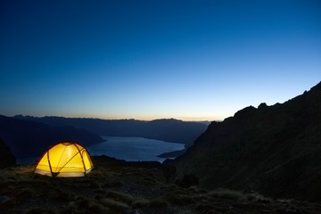 Tent By Lakeshore At Dusk