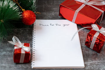 New Year and Christmas frame composition. Blank sheet of paper with christmas decorations on wooden...