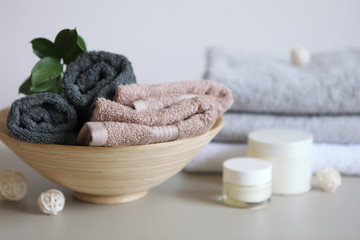 a stack of fresh towels on the table.