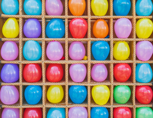 Background of multicolored real balloons in row close-up. Pattern of leisure activity.