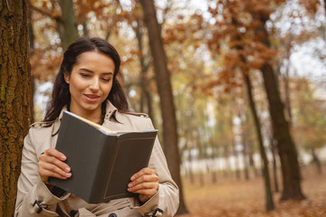 Fototapeta premium Relaxed young female person reading romantic story
