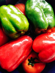 Tomatoes, green and red bell peppers disinfecting.