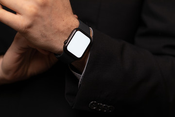 Close up of Businessman's hand looking at hand watch