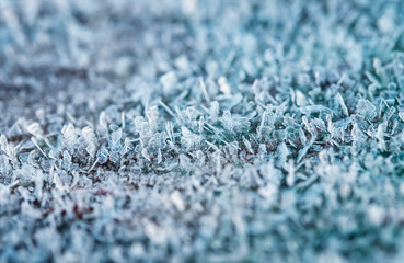 festive new year natural background with shiny transparent texture crystals of cold frost and snow cover the surface in the winter  morning