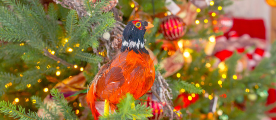 Christmas festive background. Christmas tree decorated with balls and candles, festive bokeh banner, Christmas composition