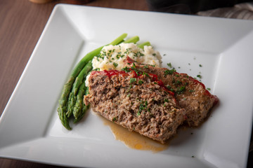 meat loaf with mashed potato and asparagus