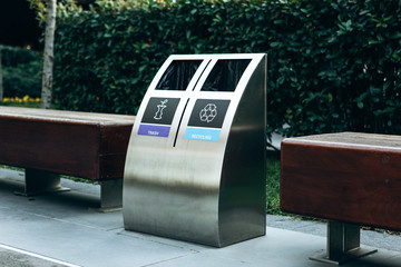 Modern waste bin for separate collection of trash and recyclable waste.