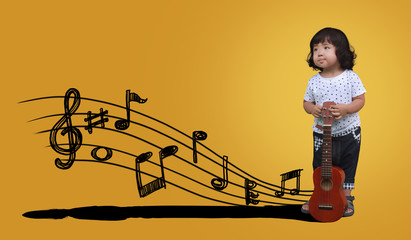 Happy kids with guitar or ukulele on colorful background.
