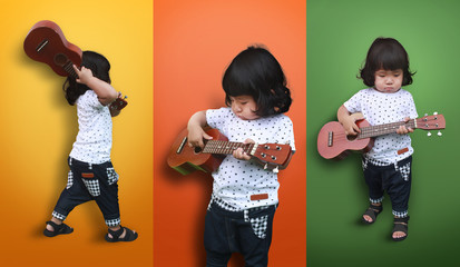 Cute kids posing on colorful background, Asian girl, Children playing guitar or ukulele.