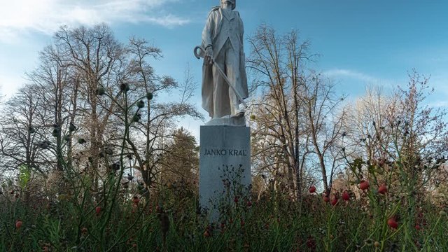 Camera moves up and showing the statue of famous Janko Kral in Bratislava, Slovakia