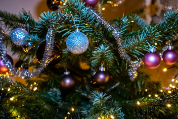 Obraz na płótnie Canvas atmospheric, colorful Christmas decoration with fairy lights and shiny Christmas balls