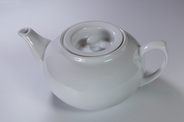 Porcelain teapot on a white background. Lifestyle.