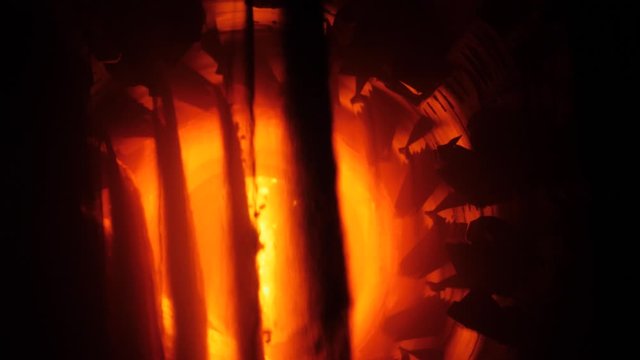 Inside of rotary burning kiln or furnace. Industrial production process of cement clinker or expanded clay. Clinkers tumble in cooling device. 