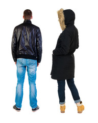 Back view of couple in winter jacket.