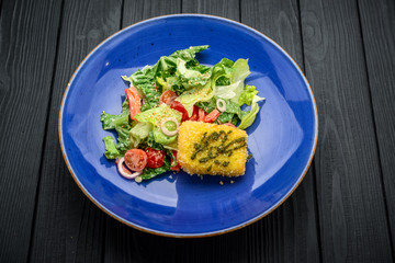 Gourmet saled topped with rounds of fried goat cheese.