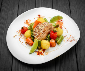 Homemade roast with carrots, potatoes and various vegetables