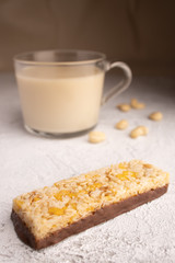 Healthy breakfast. Organic milk. Cereal granola bar. Glass cup with organic milk. Nut milk without lactose, gmo, antibiotics and casein. Diet food.  ..