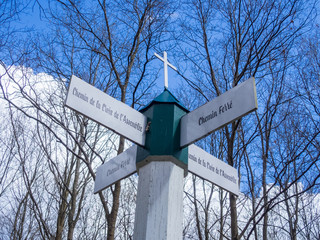 Signs on a pole in the forest  of Chantilly, at the crossroads of two paths