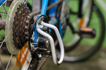 children's bike repair. View of the rear wheel and cassette close-up. Rusty old parts are replaced by new ones. High quality workshop. Rear derailleur broke.