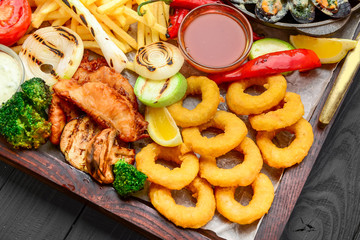 fried fish, mussels, and shrimp with potatoes