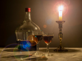 sweet muscat wine with two old crystal glasses by candlelight