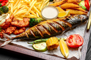 fried fish, mussels, and shrimp with potatoes