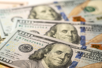 100 dollars bills close-up and portrait of Benjamin Franklin on US cash bill