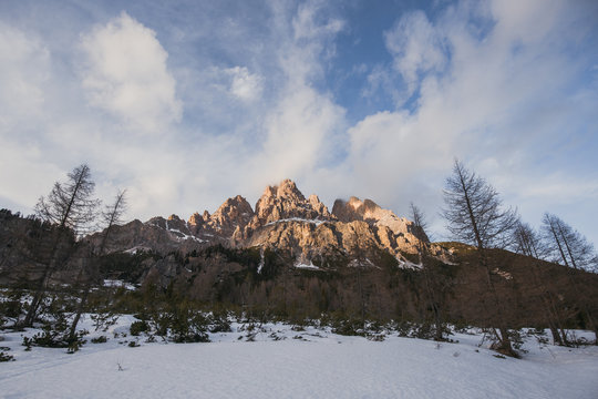 Wide mountain background with sunset light.