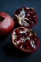 red cut garnet close up on blurred dark background