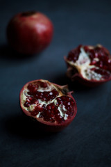 red cut garnet close up on blurred dark background