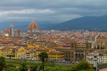 Fototapeta na wymiar Aerial view of Florence Italy, beautiful old city full of historical amazing buildings, cathedrals and bridges. 