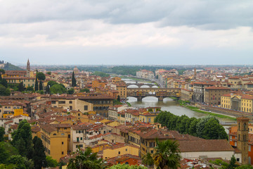 Fototapeta premium Panoramic view of The Ponte Vecchio or Old Bridge in Florence Italy, famous tourist destination. 