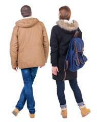 Back view of couple in winter jacket.